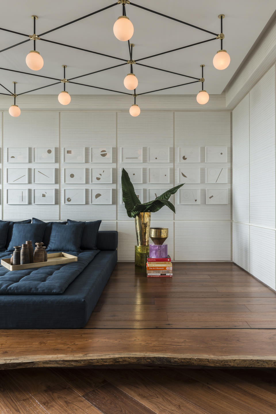 A bed with a ceiling light above