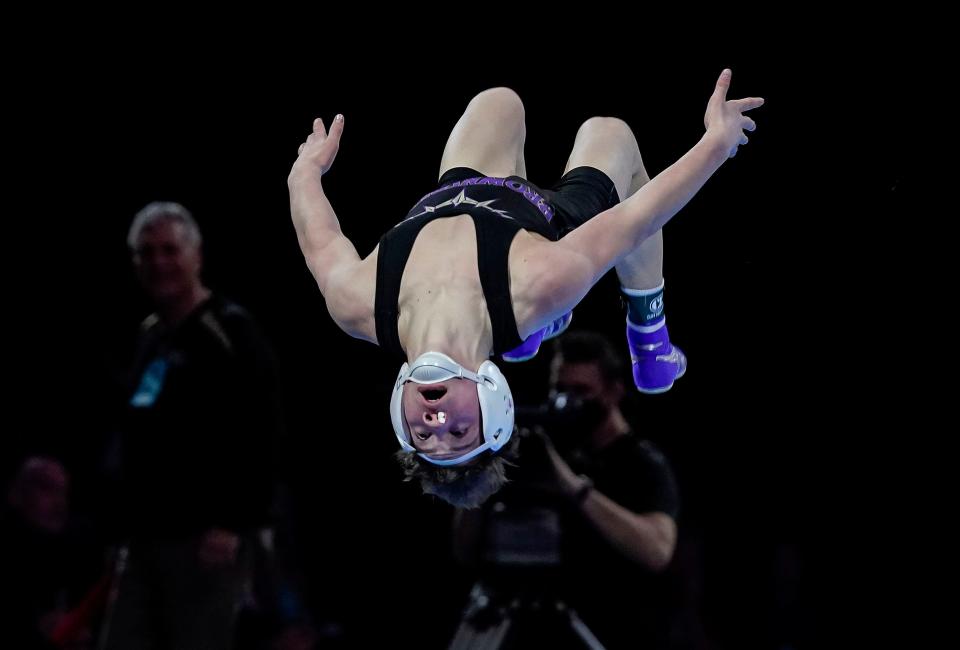 Brownsburg Jake Hockaday does a back flip to celebrate winning the 106-pound weight class during IHSAA wrestling state finals on Saturday, Feb. 19, 2022, at Gainbridge Fieldhouse in Indianapolis. 