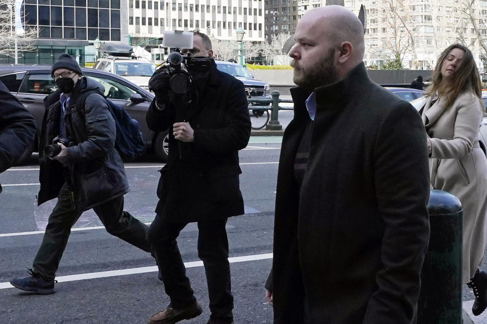 Juror No. 50, foreground, from the Ghislaine Maxwell trial, leaves federal court, in New York, Tuesday, March 8, 2022. The juror told a judge Tuesday that failing to disclose his child abuse history during jury selection at the trial of the British socialite was one of the "biggest mistakes" of his life, as a judge and lawyers try to decide whether the revelations will spoil Maxwell's sex trafficking conviction. (AP Photo/Richard Drew)