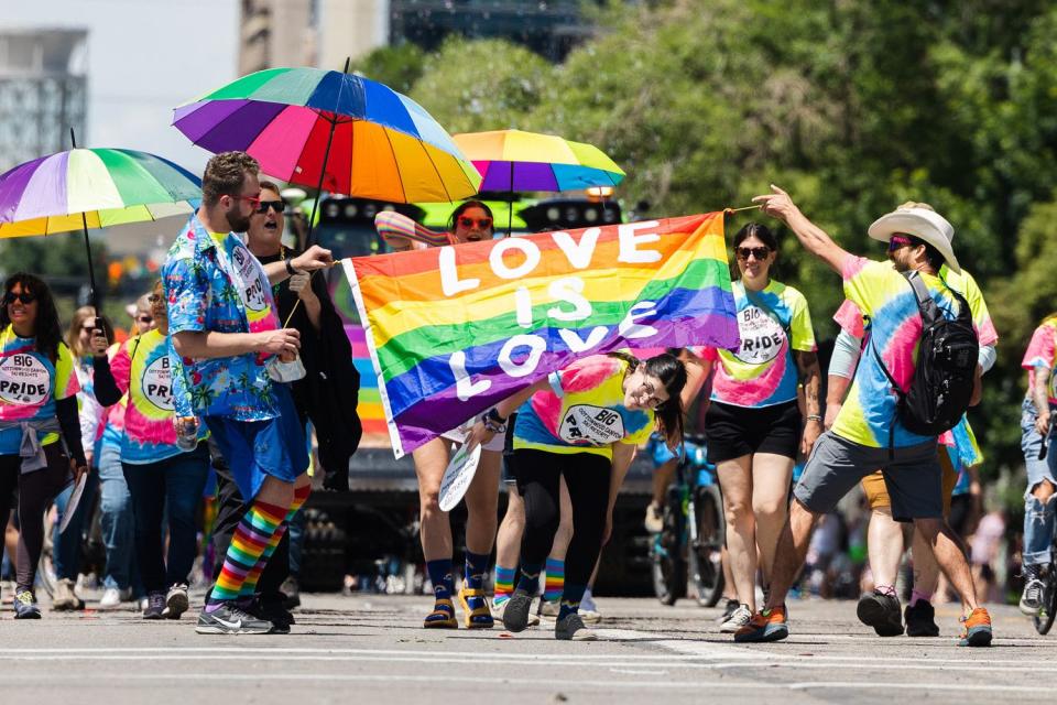 Participants walk during the 2023 Utah Pride Parade in downtown Salt Lake City on Sunday.