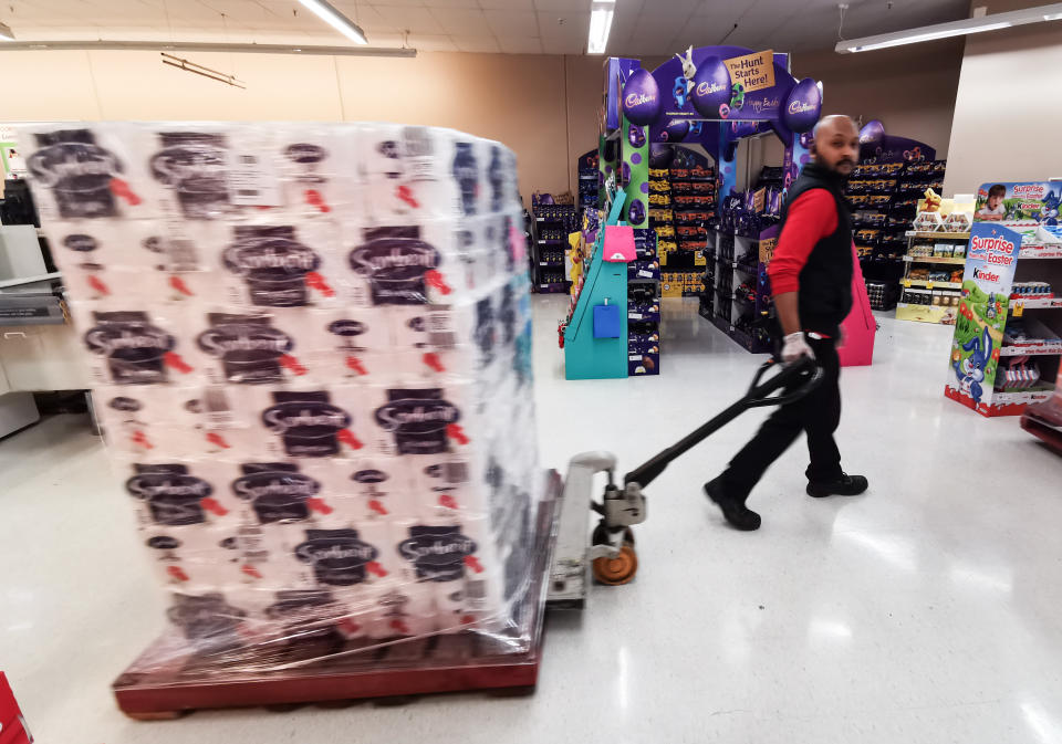 People queueing for a deliver of toilet paper, paper towel and pasta at Coles Supermarket