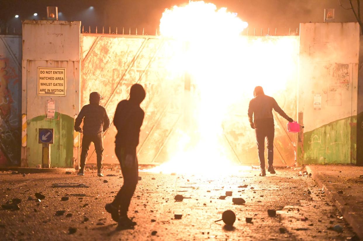 <span class="caption">Northern Irish protesters on April 7, 2021, burn the Peace Gate in Belfast, built in the 1990s to separate the city's warring Protestant and Catholic communities.</span> <span class="attribution"><a class="link " href="https://www.gettyimages.com/detail/news-photo/fire-fed-by-petrol-burns-as-youths-clashed-at-the-peace-news-photo/1232167469?adppopup=true" rel="nofollow noopener" target="_blank" data-ylk="slk:Charles McQuillan/Getty Images;elm:context_link;itc:0;sec:content-canvas">Charles McQuillan/Getty Images</a></span>