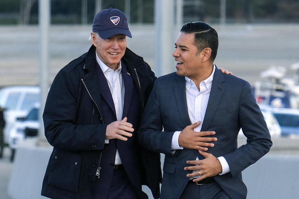 FILE - In this Jan. 9, 2020, file photo, Democratic presidential candidate Joe Biden, left, and Long Beach Mayor Robert Garcia arrive during a tour of the Gerald Desmond Bridge Replacement Project in Long Beach, Calif. The potential ascendancy of Sen. Kamala Harris to the vice presidency next year has kicked off widespread speculation about who might replace her if Democrats seize the White House. California Gov. Gavin Newsom is already being lobbied by hopefuls and numerous names are emerging in the early speculation, Garcia among them. (AP Photo/Ringo H.W. Chiu, File)