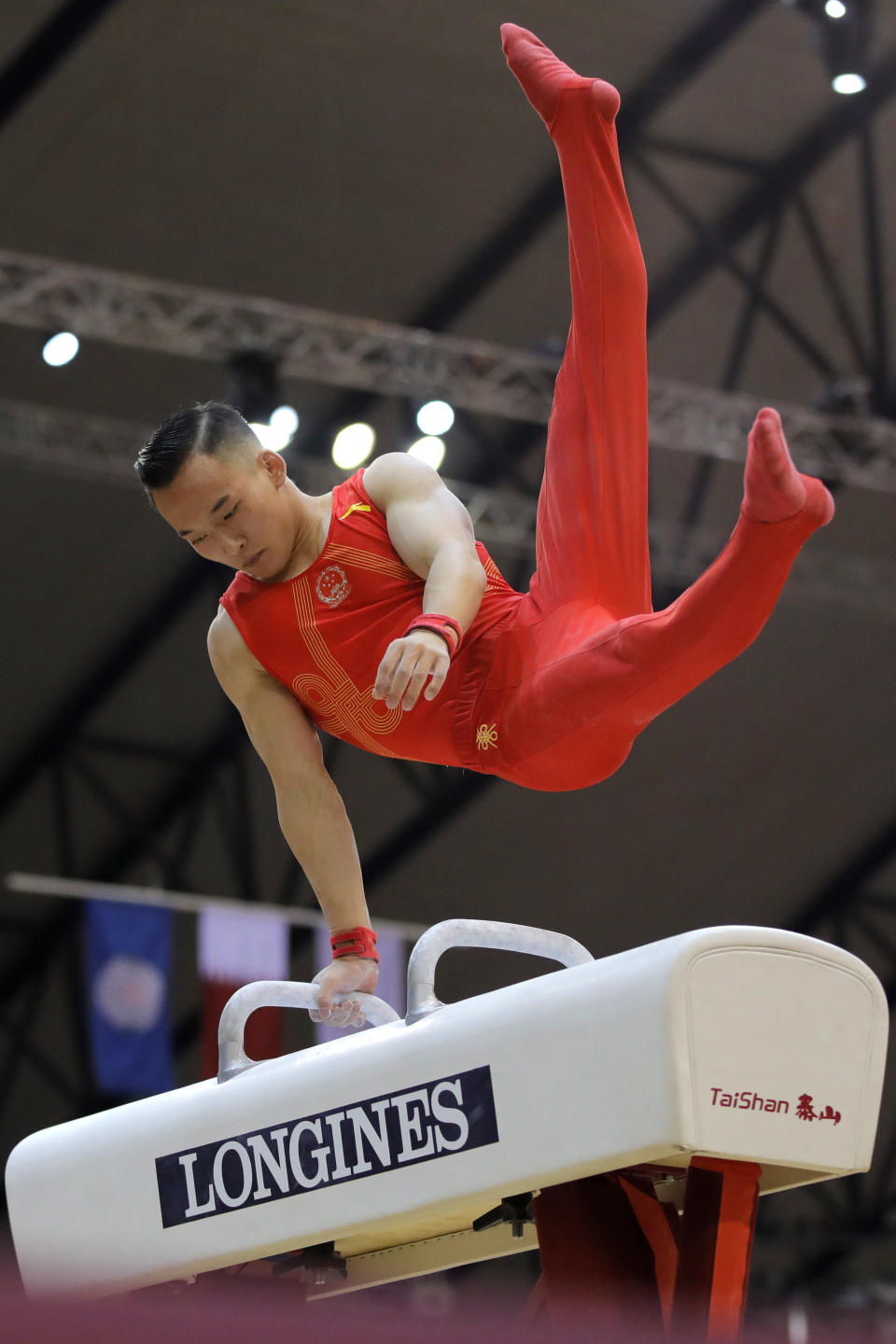 China's Xiao Ruoteng performs on the pommel horse during the Men's All-Around Final of the Gymnastics World Chamionships at the Aspire Dome in Doha, Qatar, Wednesday, Oct. 31, 2018. (AP Photo/Vadim Ghirda)