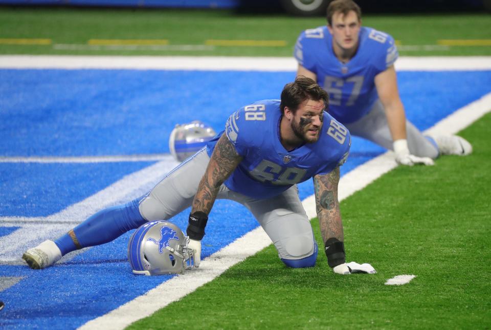 Lions offensive tackle Taylor Decker warms up before the game against the Minnesota Vikings at Ford Field on Sunday, Jan. 3, 2021.