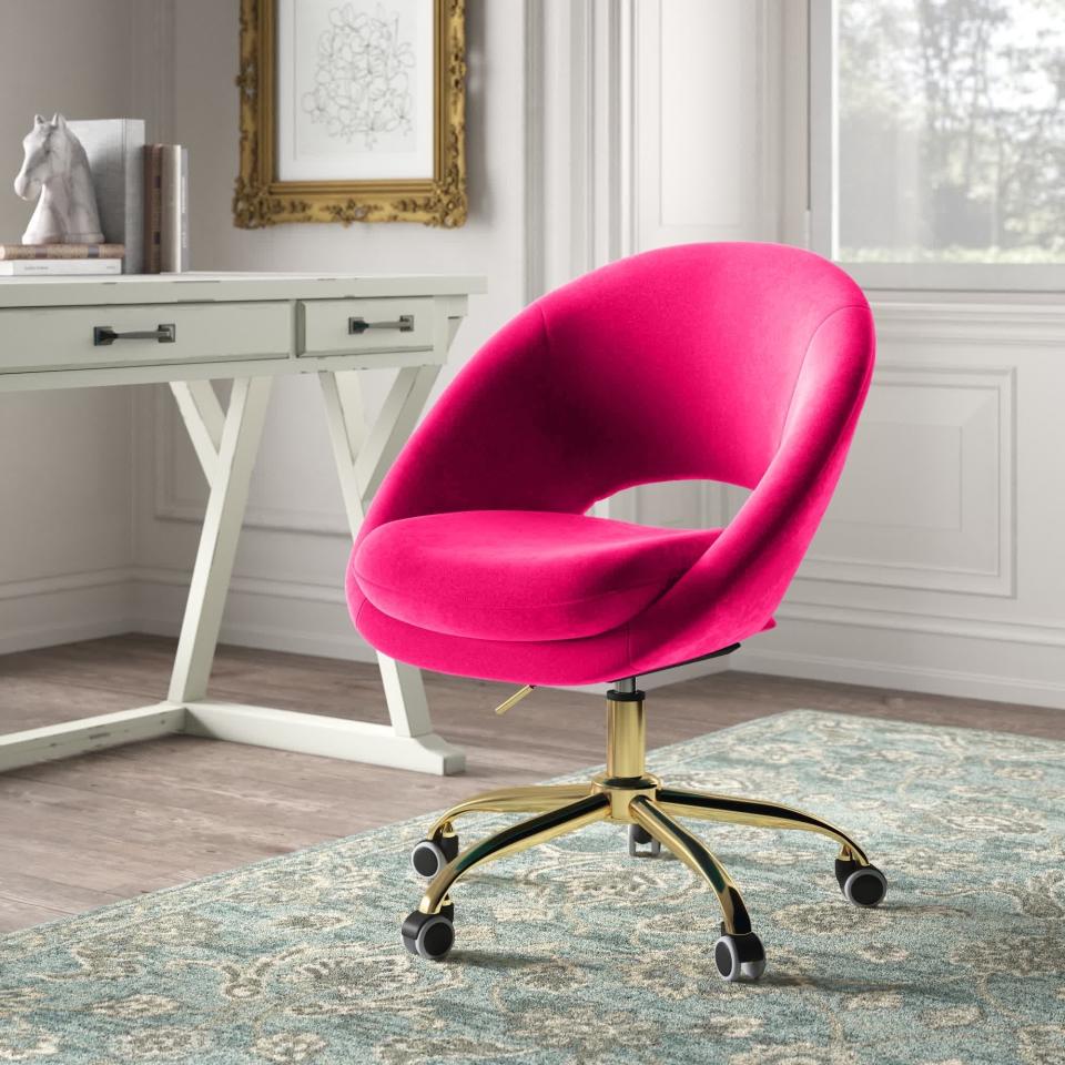 the modern chair with a partial open back and gold base