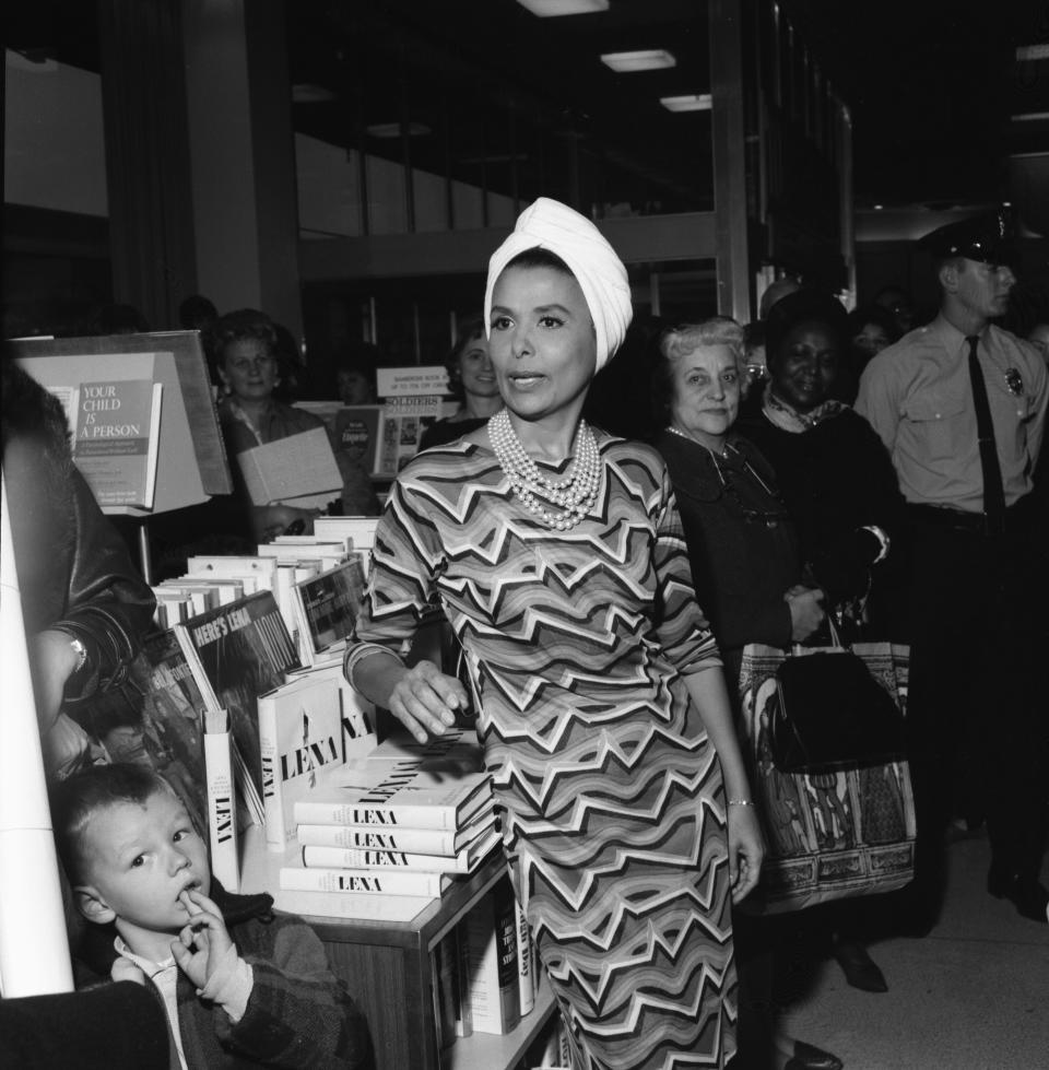 Singer Lena Horne meets fans and signs copies of her autobiographical book at Bamberger's department store at Garden State Plaza in Paramus, New Jersey on Nov. 16, 1965. Although a small area was chained off to allow the singer some distance from her admirers, she had no part of it and walked away from her escorts into the crowd.