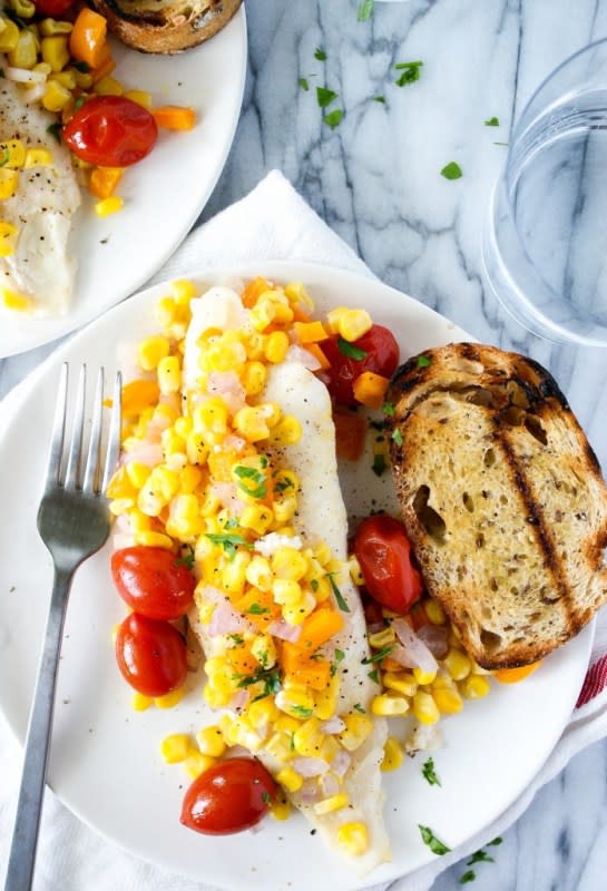 <p>This grilled tilapia in foil recipe couldn’t be easier! Simply layer a white fish in the fish foil packet, season with olive oil, salt, and pepper, top with veggies and GRILL! Lots of bright summer flavors and the perfect meal to eat outside. <strong>Get the Recipe: <a href="https://myeverydaytable.com/grilled-tilapia-in-foil-fish-foil-packets/" rel="nofollow noopener" target="_blank" data-ylk="slk:Grilled Tilapia in Foil;elm:context_link;itc:0;sec:content-canvas" class="link ">Grilled Tilapia in Foil</a></strong></p>