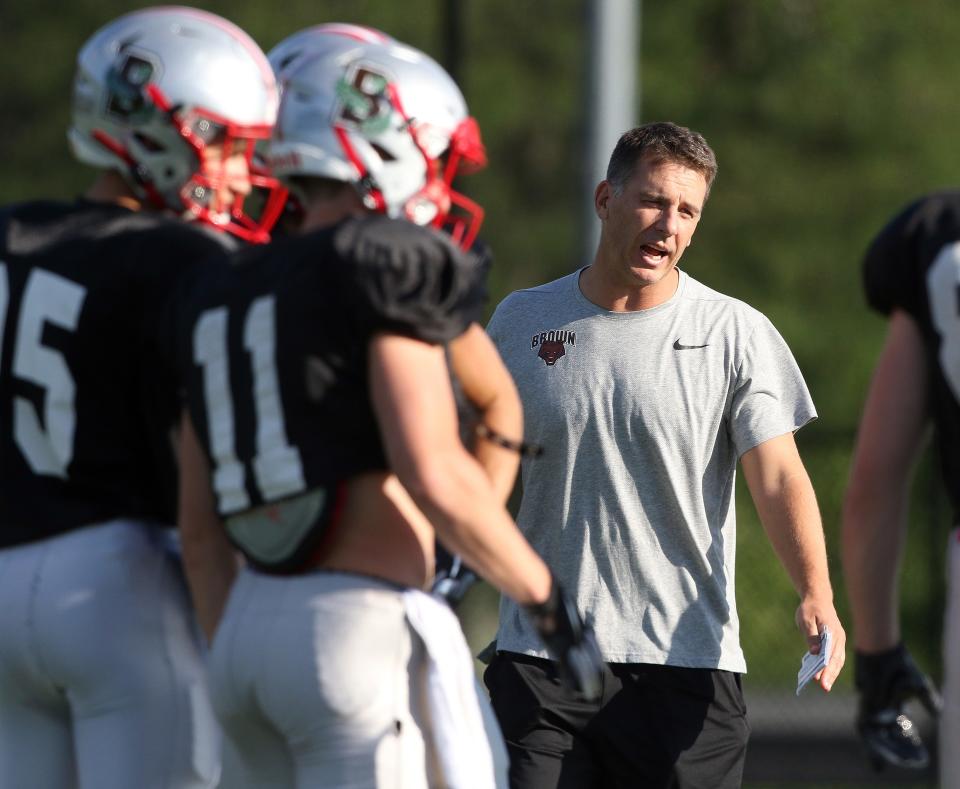 Brown coach James Perry, right, at practice in 2019. The Bears are picked seventh in the Ivy League’s preseason poll.