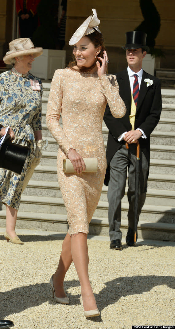 Kate wore a long-sleeved nude and lace Alexander McQueen dress for a Buckingham Palace garden party in June 2014.