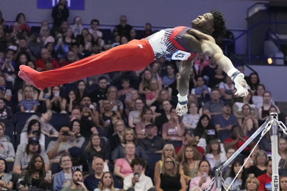 Frederick Richard competes on the horizontal bar at the United States Gymnastics Olympic Trials on Saturday, June 29, 2024, in Minneapolis. (AP Photo/Charlie Riedel)