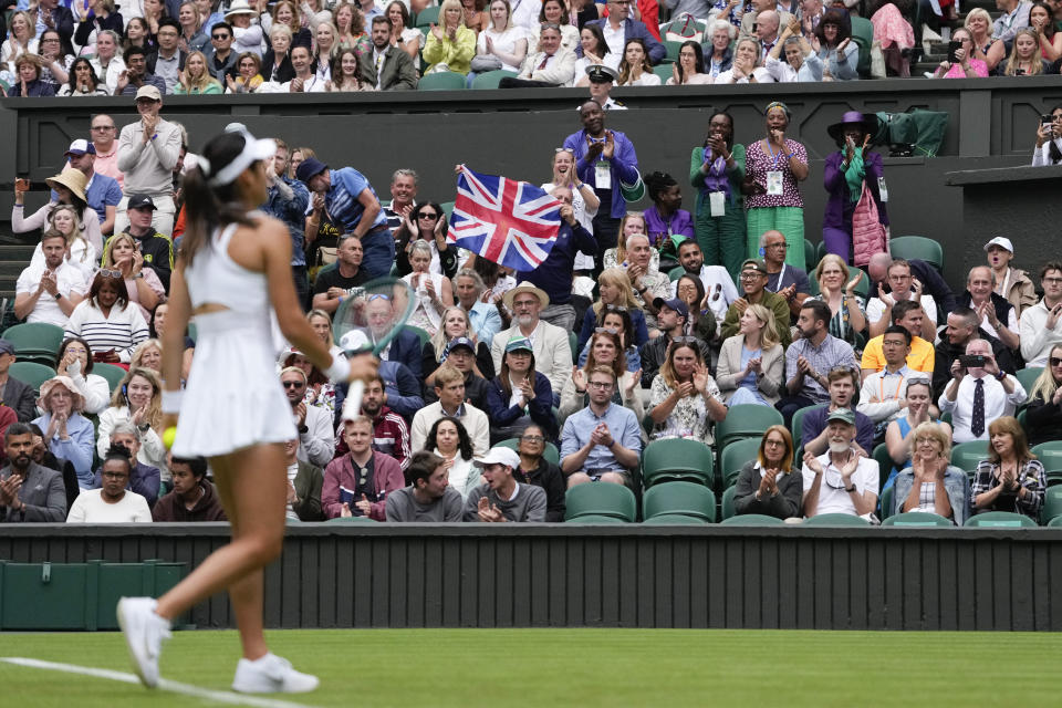 Spectators react during Emma Raducanu of Britain's first round match against Renata Zarazua of Mexico at the Wimbledon tennis championships in London, Monday, July 1, 2024. (AP Photo/Alberto Pezzali)