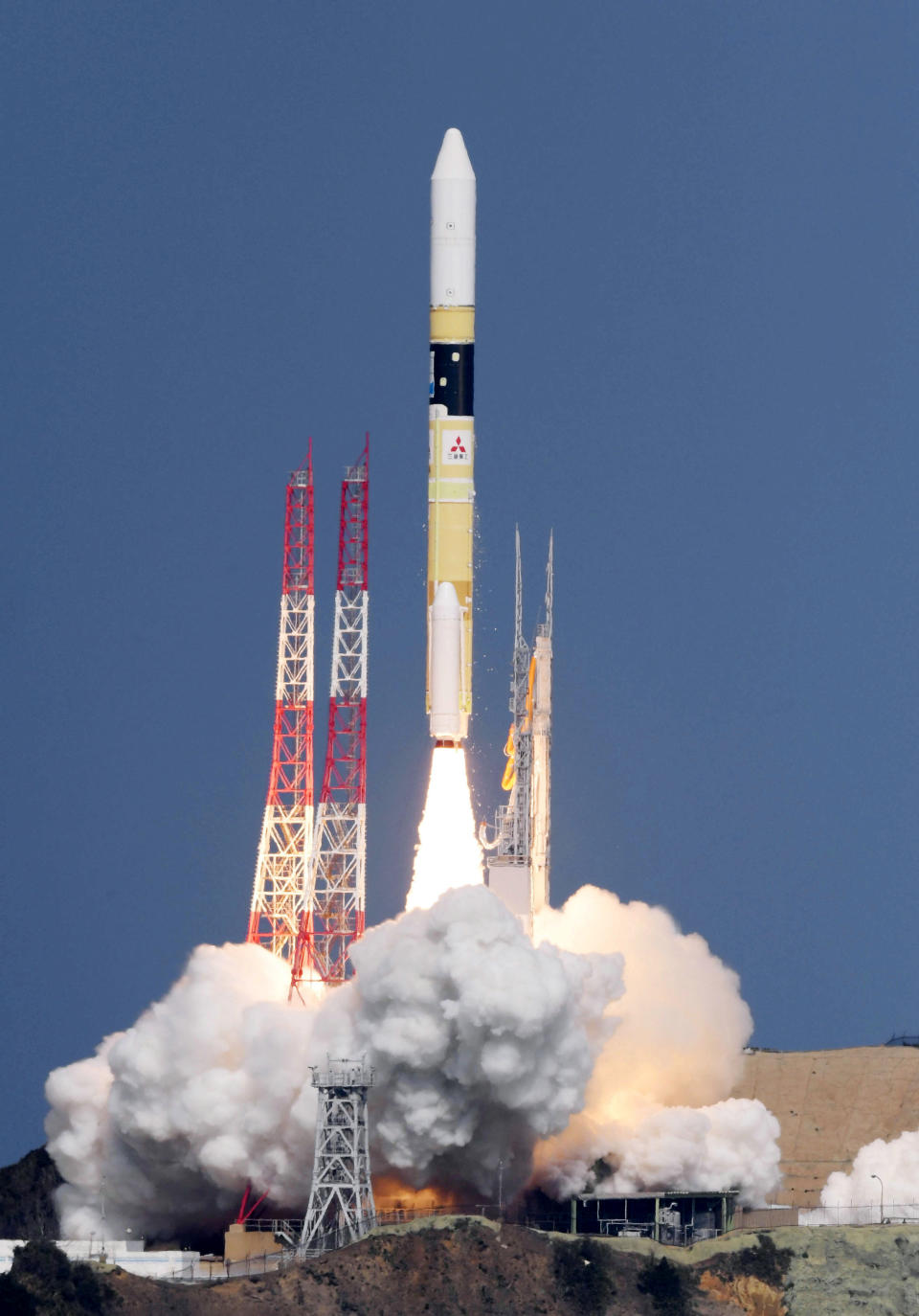 Japan's rocket H-2A is launched, carrying aboard a green gas observing satellite "Ibuki-2" and KhalifaSat, a UAE satellite, Tanegashima, southern Japan, Monday, Oct. 29, 2018. The Japanese rocket carrying United Arab Emirates' first locally-made satellite has successfully lifted off from a space center in southern Japan. (Nozomi Endo/Kyodo News via AP)