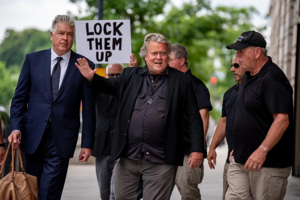 A protester greets  Bannon as he arrives at a federal courthouse in Washington DC for sentencing on June 6 (Getty Images)