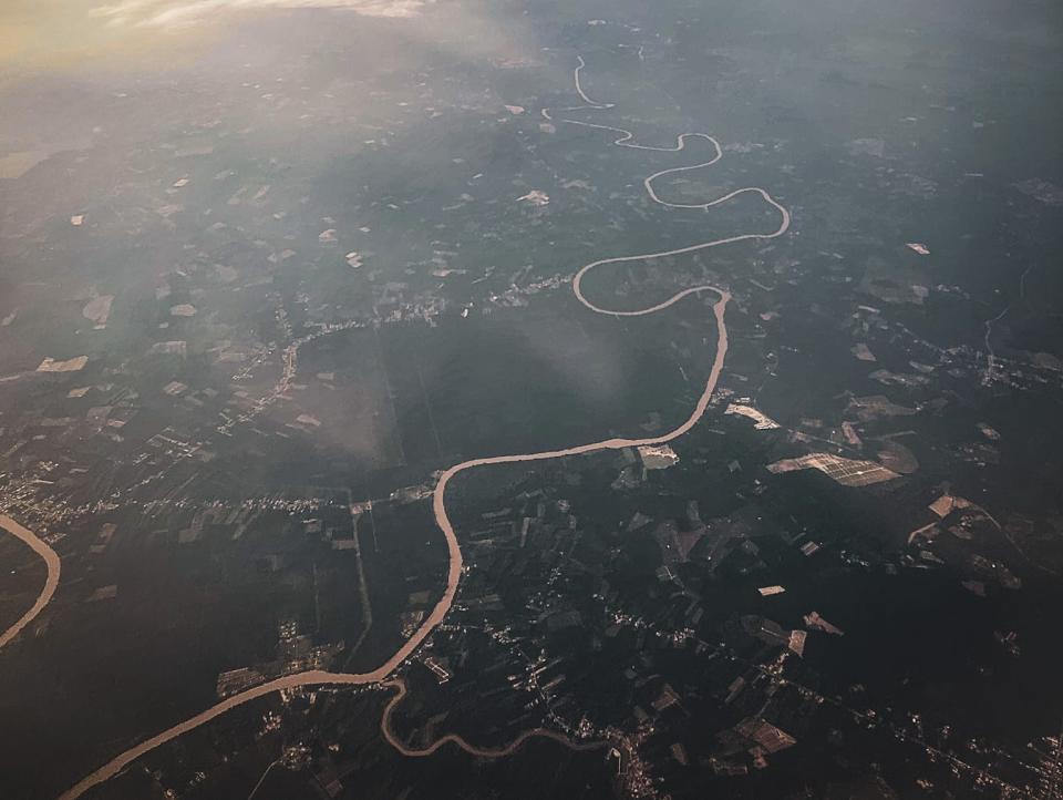 The view from the airplane showing meandering rivers.