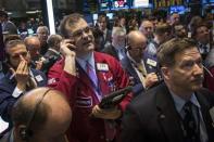 Traders work on the floor of the New York Stock Exchange April 15, 2014. REUTERS/Brendan McDermid