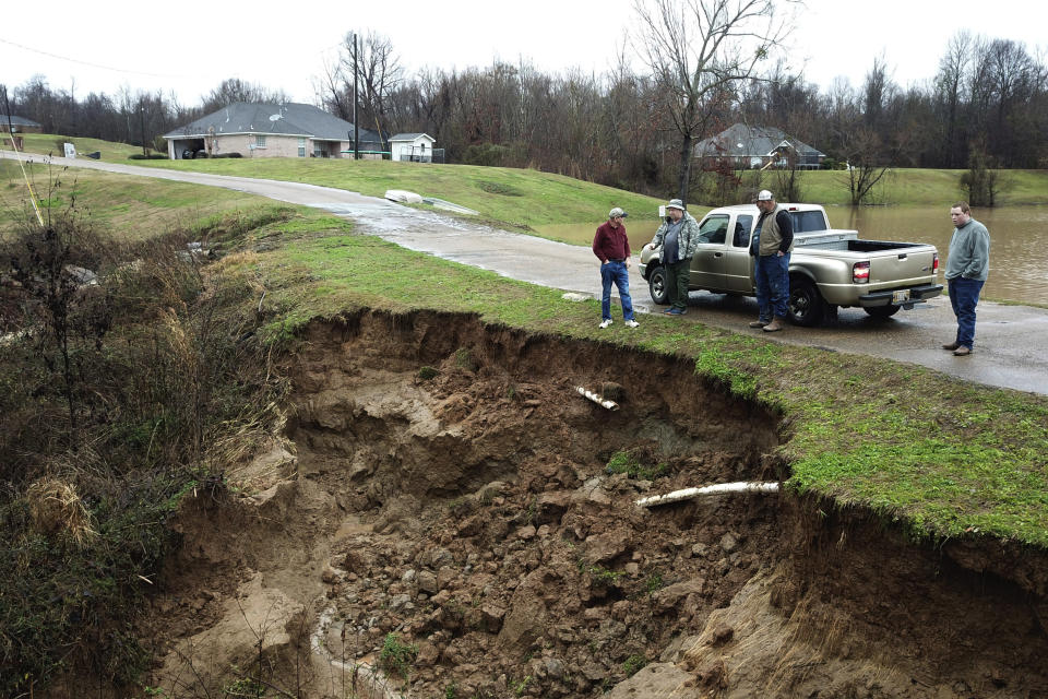 FILE - In this Feb. 11, 2020, file photo provided by the Mississippi Emergency Management Agency, area officials monitor a potential dam/levee failure in the Springridge Place subdivision in Yazoo County, Miss. Heavy rains and recent flooding across the Southeastern U.S. have highlighted a potential public safety concern for some dams. An Associated Press review has identified hundreds of high hazard dams in the South that lack formal emergency action plans. (David Battaly/Mississippi Emergency Management Agency via AP, File)