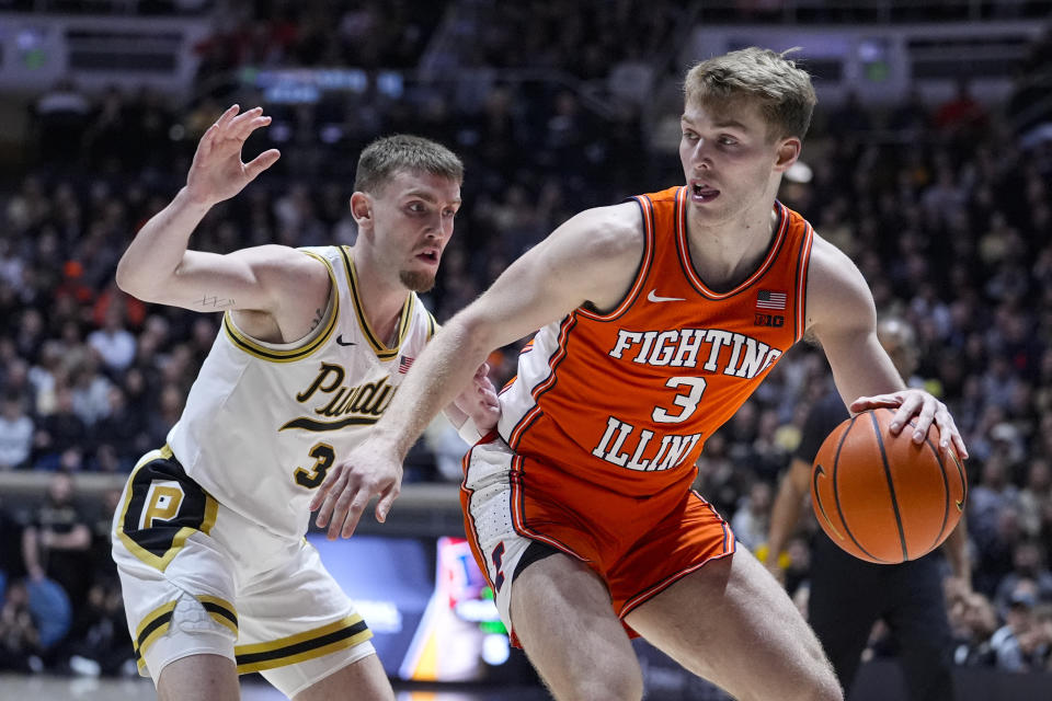 Illinois forward Marcus Domask (3) drives on Purdue guard Braden Smith (3) during the first half of an NCAA college basketball game in West Lafayette, Ind., Friday, Jan. 5, 2024. (AP Photo/Michael Conroy)