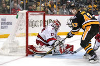 Pittsburgh Penguins' Danton Heinen (43) can't get a rebound past Carolina Hurricanes goaltender Antti Raanta (32) during the second period of an NHL hockey game in Pittsburgh, Sunday, March 13, 2022. (AP Photo/Gene J. Puskar)