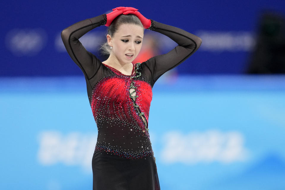 Kamila Valieva, 15, of the Russian Olympic Committee, reacts after the women's team free skate program during the figure skating competition at the 2022 Winter Olympics, Monday, Feb. 7, 2022, in Beijing. Valieva is at the center of the biggest doping story of the Beijing Games after the Russian newspaper RBC reported that the figure skater tested positive for a banned heart medication before the Olympics. Valieva is a “protected person” according to the World Anti-Doping Code, which includes athletes who have not yet turned 16 at the time of a doping violation. (AP Photo/Natacha Pisarenko)