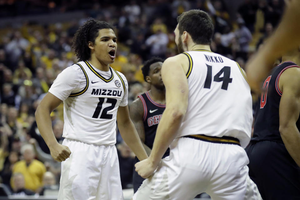 Missouri's Dru Smith (12) and Reed Nikko (14) celebrate late in the second half of the team's NCAA college basketball game against Georgia on Tuesday, Jan. 28, 2020, in Columbia, Mo. Missouri won 72-69. (AP Photo/Jeff Roberson)