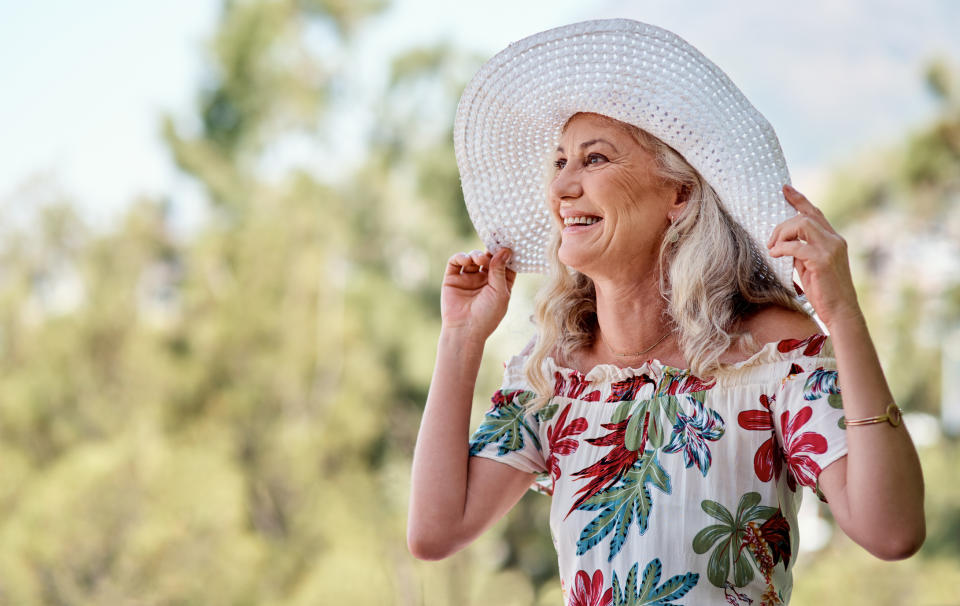 mature woman wearing wide brimmed hat