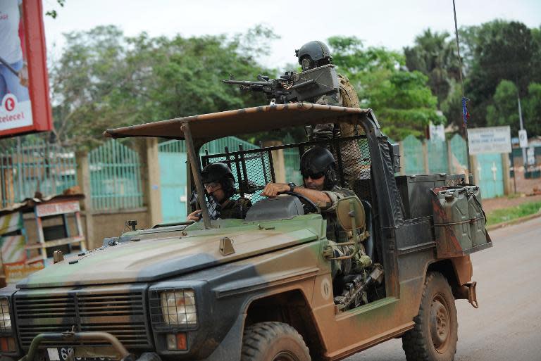 French soldiers patrol through the streets of Bangui, on December 6, 2013