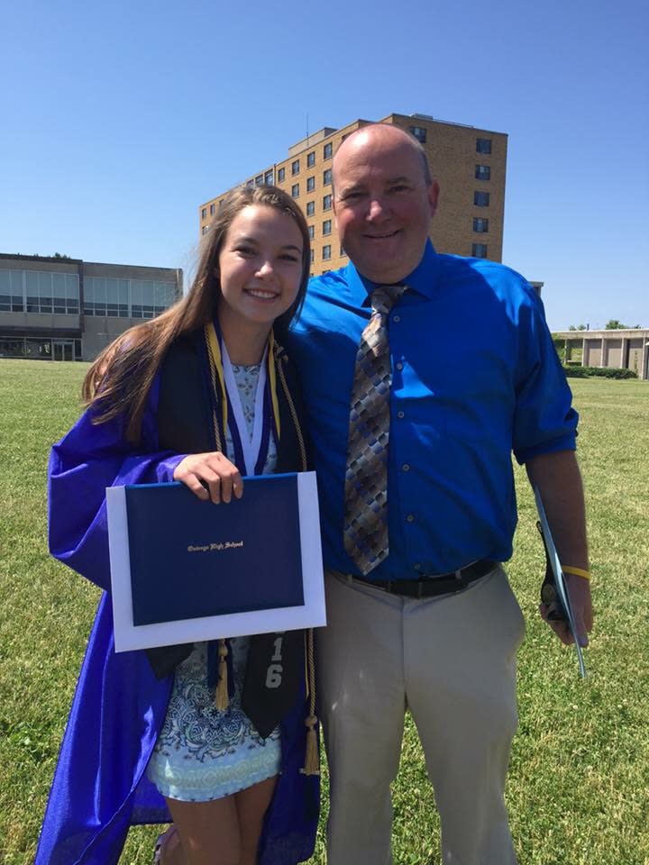 Firefighter Sean O’Gorman (pictured with his daughter) saved the lives of a group of teens caught in a rip current. (Photo: Courtesy of Sean O’Gorman)