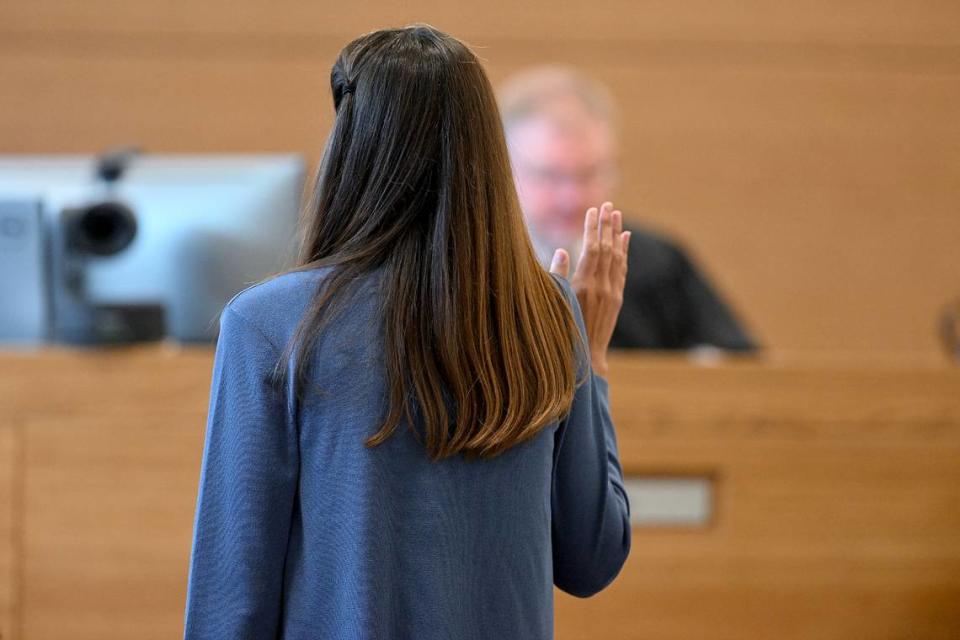 Ashley Benefield is sworn in for testimony on the fourth day of her trial for the second-degree murder of her husband, Doug Benefield, in 2020 at the Manatee County Judicial Center, July 26, 2024.