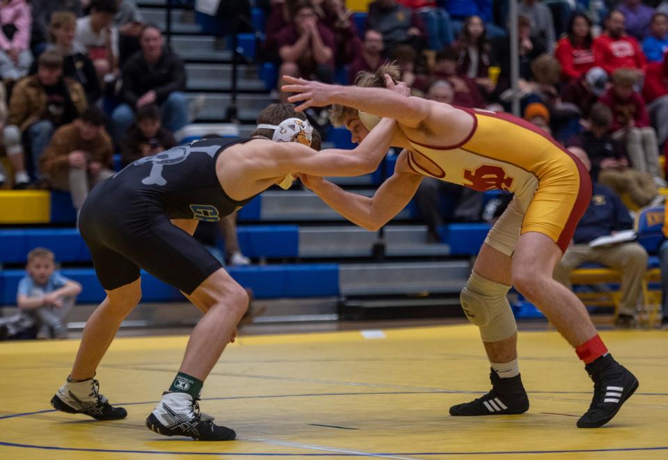 Isaiah Schaefer of Evansville Mater Dei and Leighton Ramsey of Castle compete in the 120-pound championship match during the 2023 IHSAA Regional Wrestling tournament at Castle High School in Newburgh, Ind., Saturday afternoon, Feb. 4, 2023.