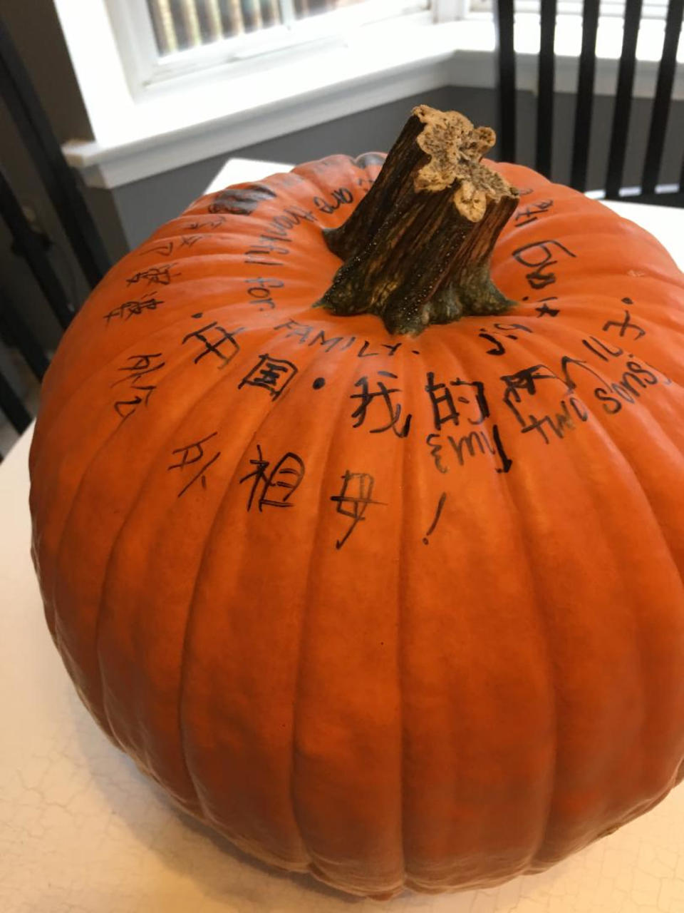 Last year, Latta's family welcomed a new son just in time to show him the Thankful Pumpkin tradition. Nathan, 11, wrote the things he was grateful for in Chinese, his native language. (Courtesy of Amy Latta)