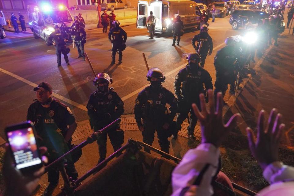 Police set up a line outside the First Unitarian church on Thursday in Louisville.