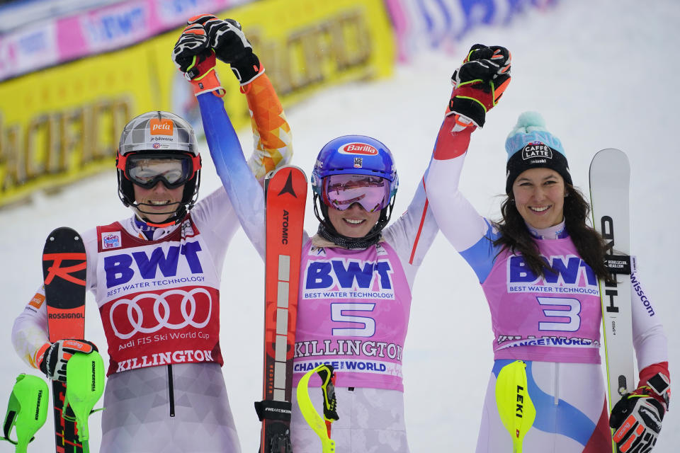 First-place finisher United State's Mikaela Shiffrin, center, poses beside second-place finisher Slovakia's Petra Vlhova, left, and third-place finisher Switzerland's Wendy Holdener after a women's World Cup slalom ski race Sunday, Nov. 28, 2021, Killington, Vt. (AP Photo/Robert F. Bukaty)