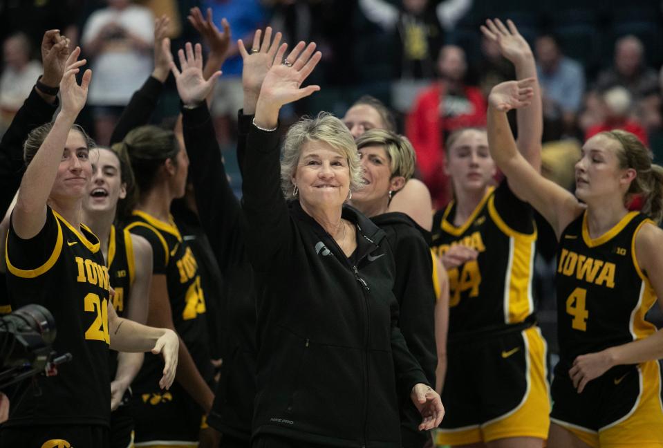 Iowa coach Lisa Bluder celebrates her 500th win with her players after their win over FGCU play in the 2023 Women's Gulf Coast Showcase on Saturday, Nov. 25, 2023, at Hertz Arena in Estero.