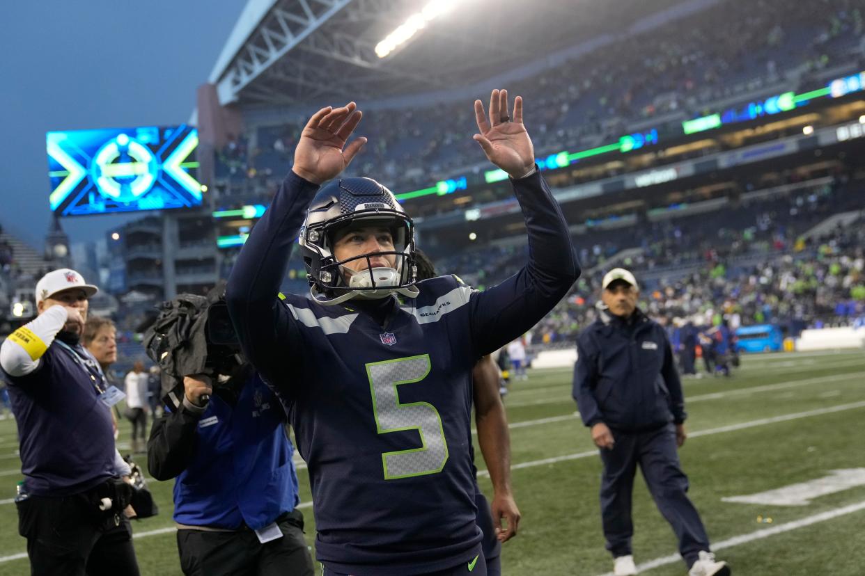 Seattle Seahawks place kicker Jason Myers (5) celebrates after making the game-winning field goal in overtime of an NFL football game against the Los Angeles Rams Sunday, Jan. 8, 2023, in Seattle. (AP Photo/Stephen Brashear)