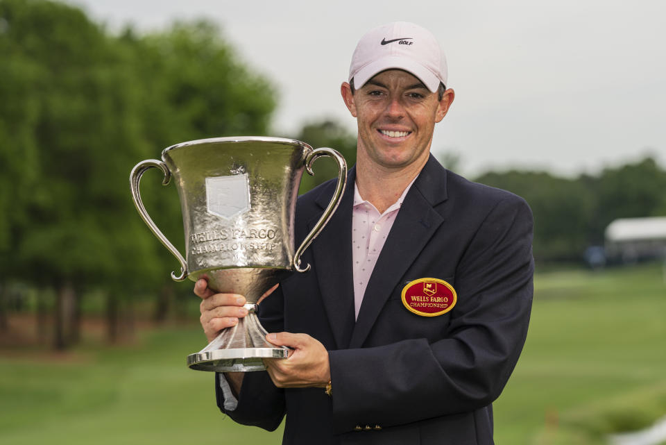 Rory McIlroy holds the trophy after winning during the fourth round of the Wells Fargo Championship golf tournament at Quail Hollow on Sunday, May 9, 2021, in Charlotte, N.C. (AP Photo/Jacob Kupferman)