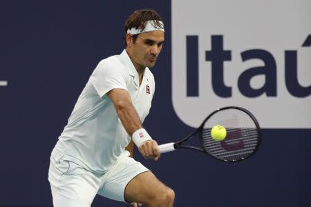 Mar 23, 2019; Miami Gardens, FL, USA; Roger Federer of Switzerland hits a backhand against Radu Albot of Moldova (not pictured) in the second round of the Miami Open at Miami Open Tennis Complex. Mandatory Credit: Geoff Burke-USA TODAY Sports