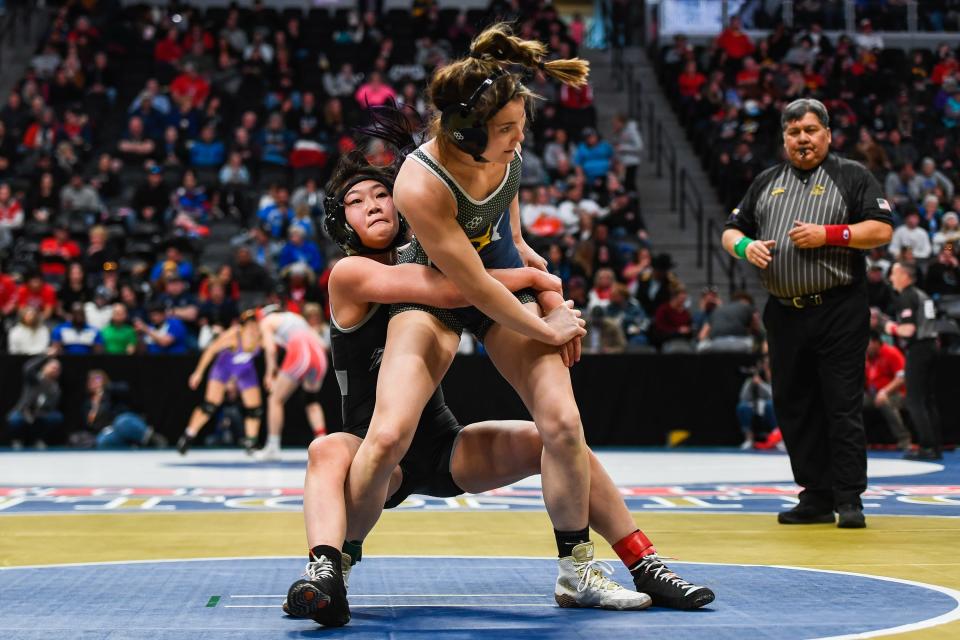 Poudre's Aubrey First, right, battles Discovery Canyon's Claire Donahue at the Colorado state wrestling tournament at Ball Arena on Thursday, Feb. 16, 2023 in Denver, Colo. First lost by fall in the second round.
