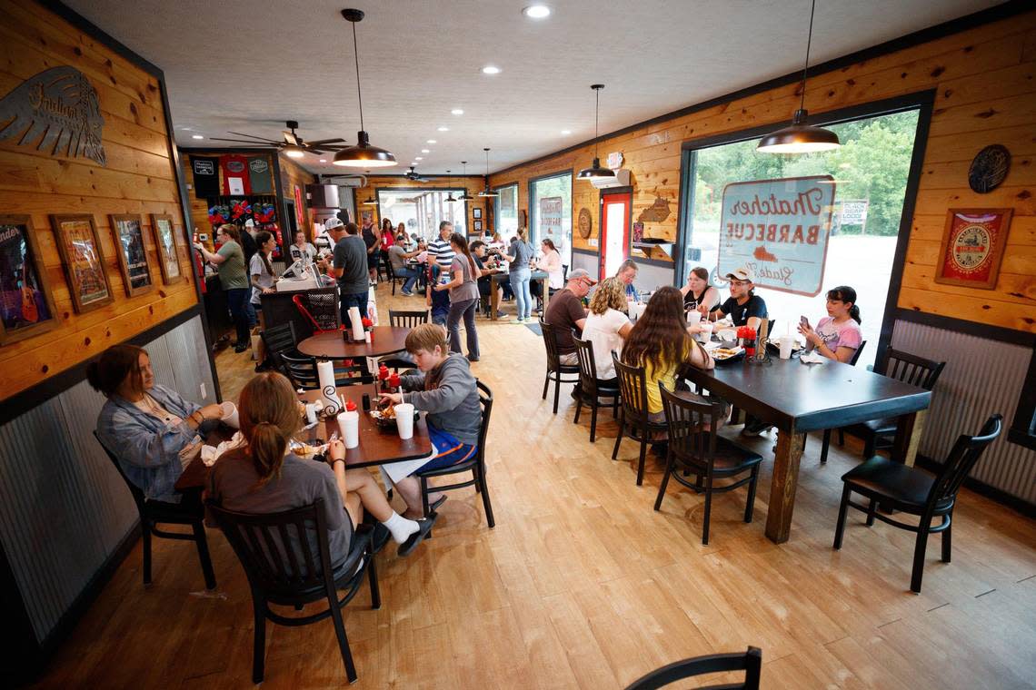 Customers sit and eat on Sunday, June 12, 2022, at Thatcher Barbecue Comapny in Slade, Kentucky.