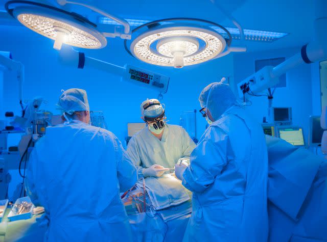 <p>Getty</p> Stock image of surgeons performing open heart surgery in modern operation room