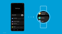 <p>A screenshot showing the new Samsung One UI Watch experience based on Wear OS. A phone showing a Settings screen on the left, three dots in the middle and a watch on the right showing similar Settings.</p> 