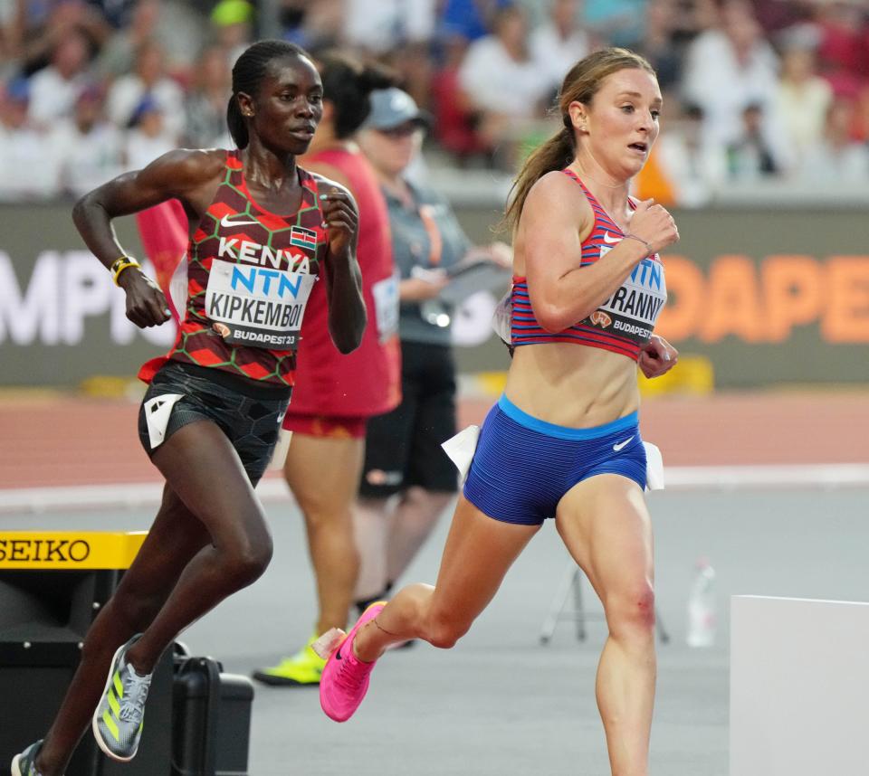 Elise Cranny, right, runs in her women's 5,000-meter semifinal Wednesday during the World Athletics Championships at National Athletics Centre.