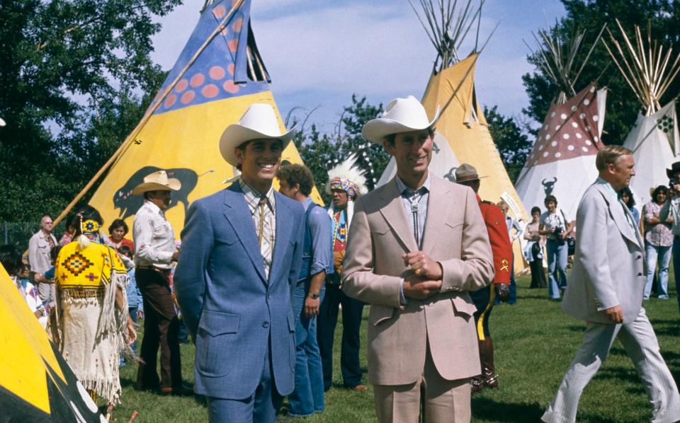 Gone country: Then-Prince Charles and Prince Andrew wore business cowboy outfits for Stampede in 1977