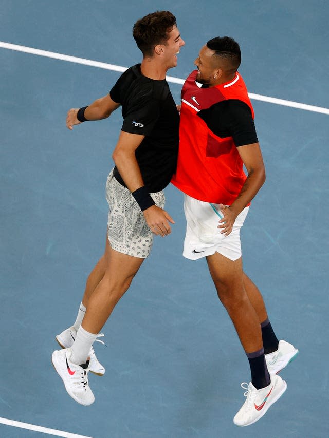 Nick Kyrgios, right, and Thanasi Kokkinakis celebrate with a chest bump