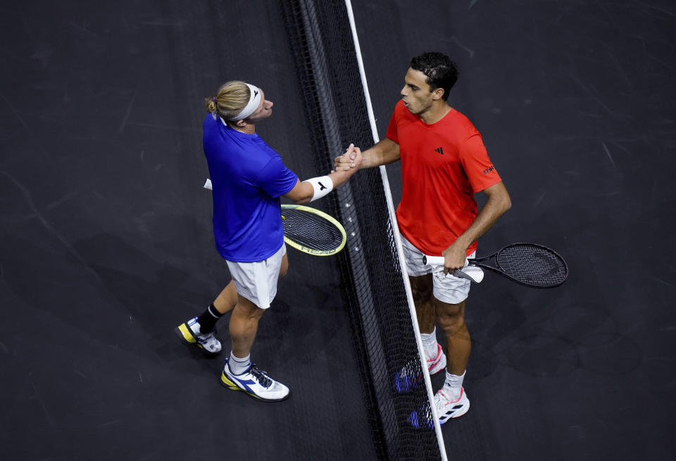 Team Europe's Alejandro Davidovich Fokina, left, and Team World's Francisco Cerundolo shake hands after Cerundolo won a Laver Cup tennis match Friday, Sept. 22, 2023, in Vancouver, British Columbia. (Darryl Dyck/The Canadian Press via AP)