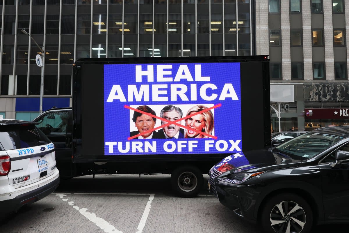 A video truck displays a message as members of the Rise and Resist protest group take part in their weekly ‘Truth Tuesday’ protest at News Corp headquarters on February 21, 2023 in New York City (Getty)