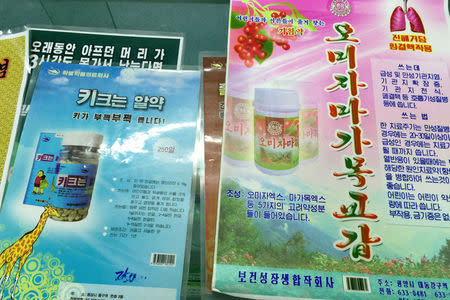 Posters advertising cough medicine and pills to make people grow taller are seen in a shop in central Pyongyang, North Korea May 4, 2016. REUTERS/James Pearson