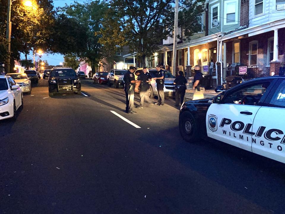 Three of the killings occurred in fall of 2020. In this file photo from Sept. 12, 2020, police work the scene of a 19-year-old's fatal shooting in Wilmington's Hedgeville neighborhood. The shooting was the fourth one of the day for the city.