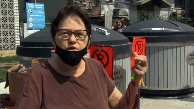 Shelley Roy is among those who fell on the ice this winter trying to load her trash into the bins and she says she has to keep her windows closed this summer because of the smell.  (CBC - image credit)