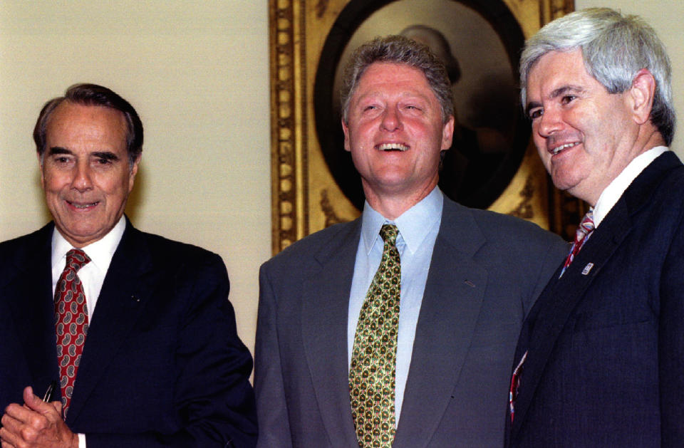 Then-President Bill Clinton then-incoming Senate Majority Leader Bob Dole, left, and House Speaker-to-be Newt Gingrich in 1994.